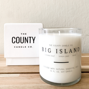 Big Island hand-poured tomato leaf, lemon peel, and moss premium soy candle in a clear glass jar made by The County Candle Co.  Hand-poured and made from 100% premium soy wax, cotton wicks, and phthalate-free fragrances infused with essential oils, we pride ourselves on creating luxurious candles using time-honored technique and eco-conscious materials. Made in Prince Edward County, Ontario, Canada. 