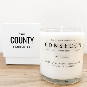 Consecon hand-poured palo Santo, white cedar, and camphor premium soy candle in a clear glass jar made by The County Candle Co.  Hand-poured and made from 100% premium soy wax, cotton wicks, and phthalate-free fragrances infused with essential oils, we pride ourselves on creating luxurious candles using time-honored technique and eco-conscious materials. Made in Prince Edward County, Ontario, Canada. 