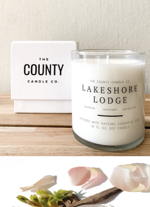 Open image in slideshow, Lakeshore Lodge hand-poured jasmine, lavender, and geranium premium soy candle in a clear glass jar made by The County Candle Co.  Hand-poured and made from 100% premium soy wax, cotton wicks, and phthalate-free fragrances infused with essential oils, we pride ourselves on creating luxurious candles using time-honored technique and eco-conscious materials. Made in Prince Edward County, Ontario, Canada. 
