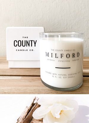 Open image in slideshow, Milford hand-poured gardenia, ylang yang, and tuberose premium soy candle in a clear glass jar made by The County Candle Co.  Hand-poured and made from 100% premium soy wax, cotton wicks, and phthalate-free fragrances infused with essential oils, we pride ourselves on creating luxurious candles using time-honored technique and eco-conscious materials. Made in Prince Edward County, Ontario, Canada. 
