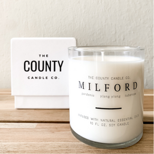 Milford hand-poured gardenia, ylang yang, and tuberose premium soy candle in a clear glass jar made by The County Candle Co.  Hand-poured and made from 100% premium soy wax, cotton wicks, and phthalate-free fragrances infused with essential oils, we pride ourselves on creating luxurious candles using time-honored technique and eco-conscious materials. Made in Prince Edward County, Ontario, Canada. 