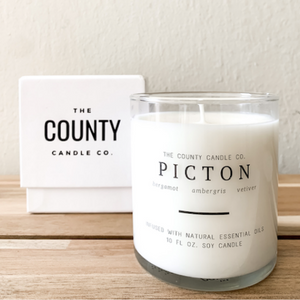 Picton hand-poured bergamot, ambergris, and vetiver premium soy candle in a clear glass jar made by The County Candle Co.  Hand-poured and made from 100% premium soy wax, cotton wicks, and phthalate-free fragrances infused with essential oils, we pride ourselves on creating luxurious candles using time-honored technique and eco-conscious materials. Made in Prince Edward County, Ontario, Canada. 