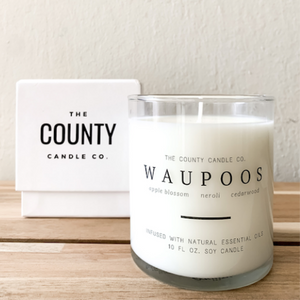 Waupoos hand-poured apple blossom, neroli, and cedar wood premium soy candle in a clear glass jar made by The County Candle Co.  Hand-poured and made from 100% premium soy wax, cotton wicks, and phthalate-free fragrances infused with essential oils, we pride ourselves on creating luxurious candles using time-honored technique and eco-conscious materials. Made in Prince Edward County, Ontario, Canada. 