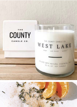 Open image in slideshow, West Lake hand-poured sage, oak moss, and amber premium soy candle in a clear glass jar made by The County Candle Co.  Hand-poured and made from 100% premium soy wax, cotton wicks, and phthalate-free fragrances infused with essential oils, we pride ourselves on creating luxurious candles using time-honored technique and eco-conscious materials. Made in Prince Edward County, Ontario, Canada. 
